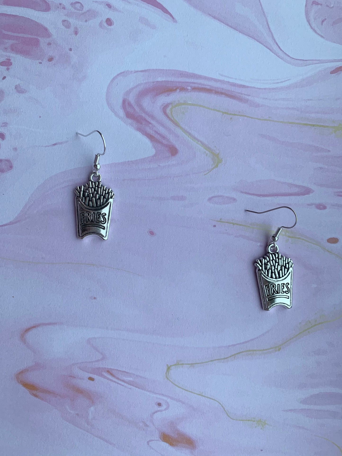 Fries earrings. food earrings. quirky earrings. funky earrings. Silver coloured alloy fries charm on silver plated hooks. dangle earrings.