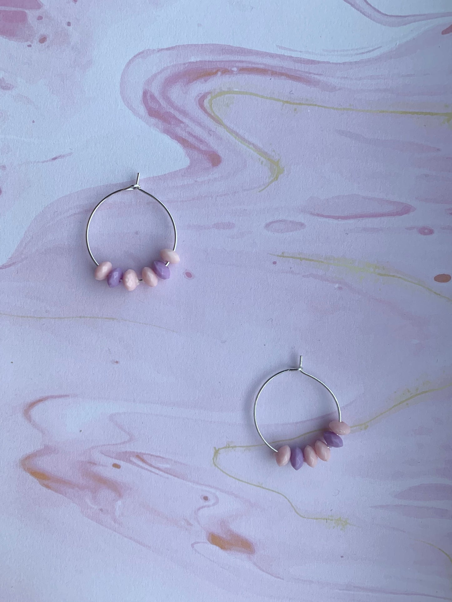 Pink and purple pastel bead earrings on silver plated hoops. hoop earrings. funky earrings.