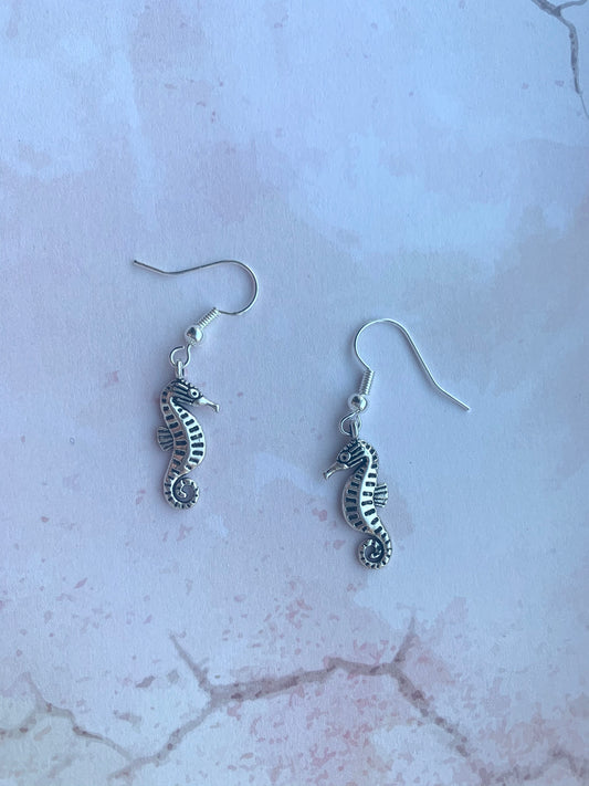 seahorse earrings. holiday earrings. Silver coloured alloy seahorse charm on silver plated hooks. cute earrings. animal earrings.