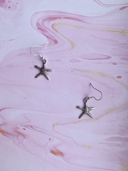 starfish earrings. mermaid earrings. alloy silver coloured charm on silver plated hooks. cute earrings. dangle earrings. holiday earrings.
