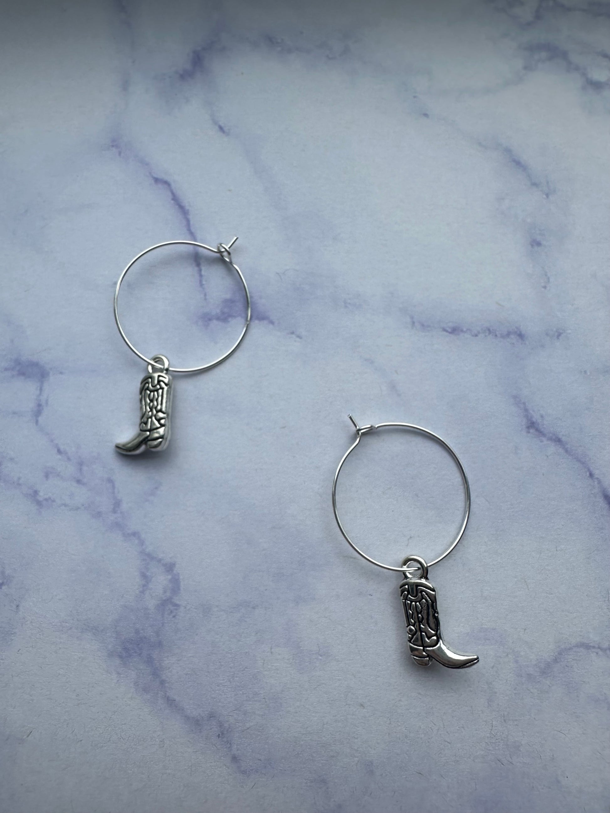 Unique western-style cowboy boot earrings on hoops ideal for hen parties and country fashion lovers.