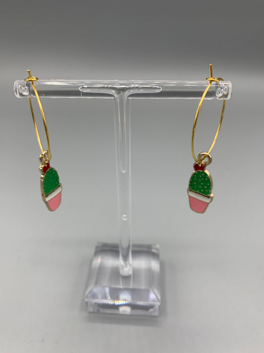 Super cute novelty cacti earrings for women. Enamel cacti charms with a pink flowerpot, red flower and green plant on gold plated hoops. Great earrings for a nature lover or plant mom. 