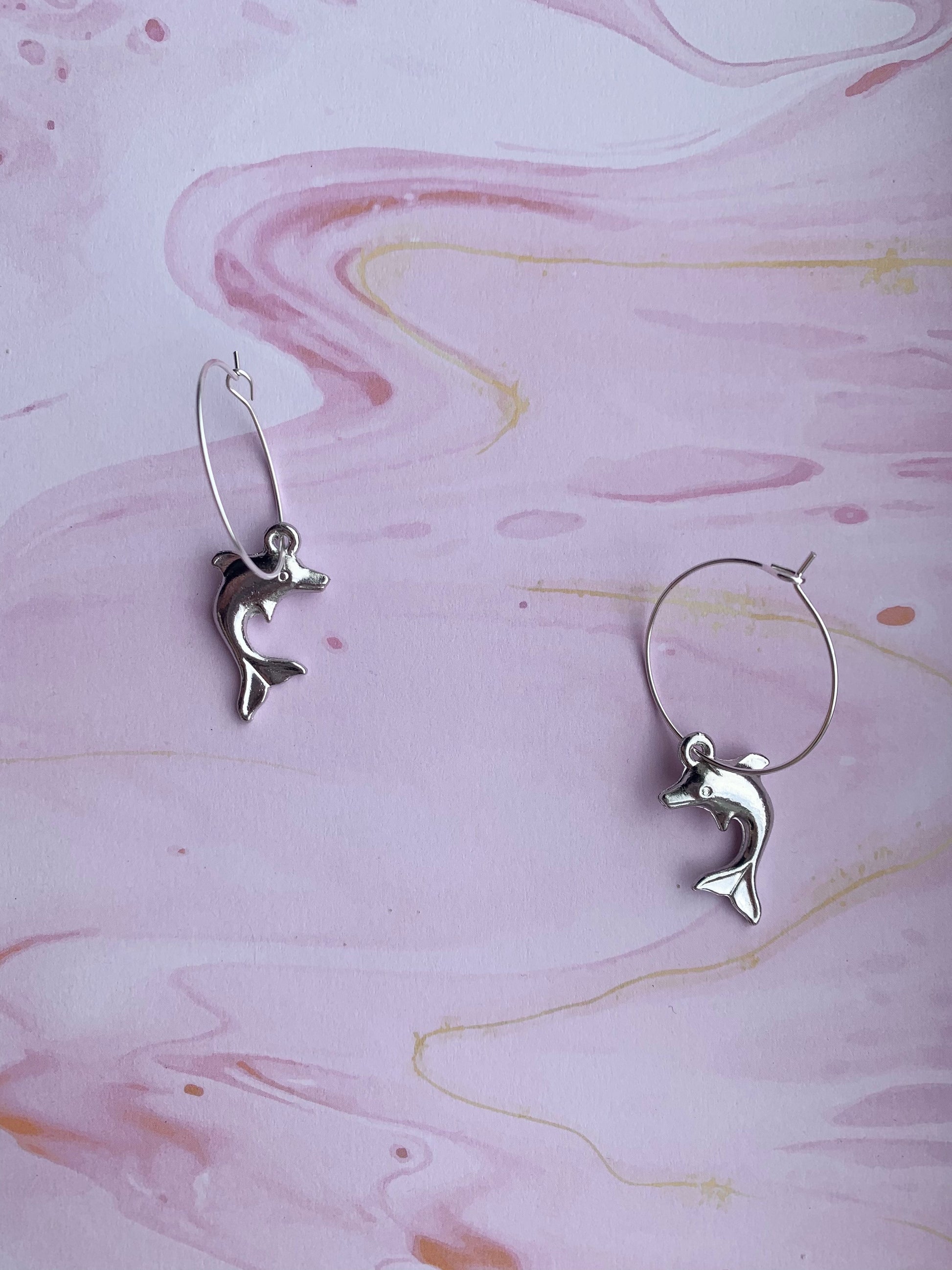 Silver plated dolphin charms on silver plated hoops. Animal earrings. Nature earrings. 