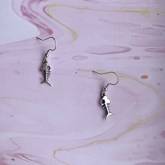 Alloy silver coloured fish skeleton charm on silver plated hooks. dangle earrings. goth earrings. bone earrings. 