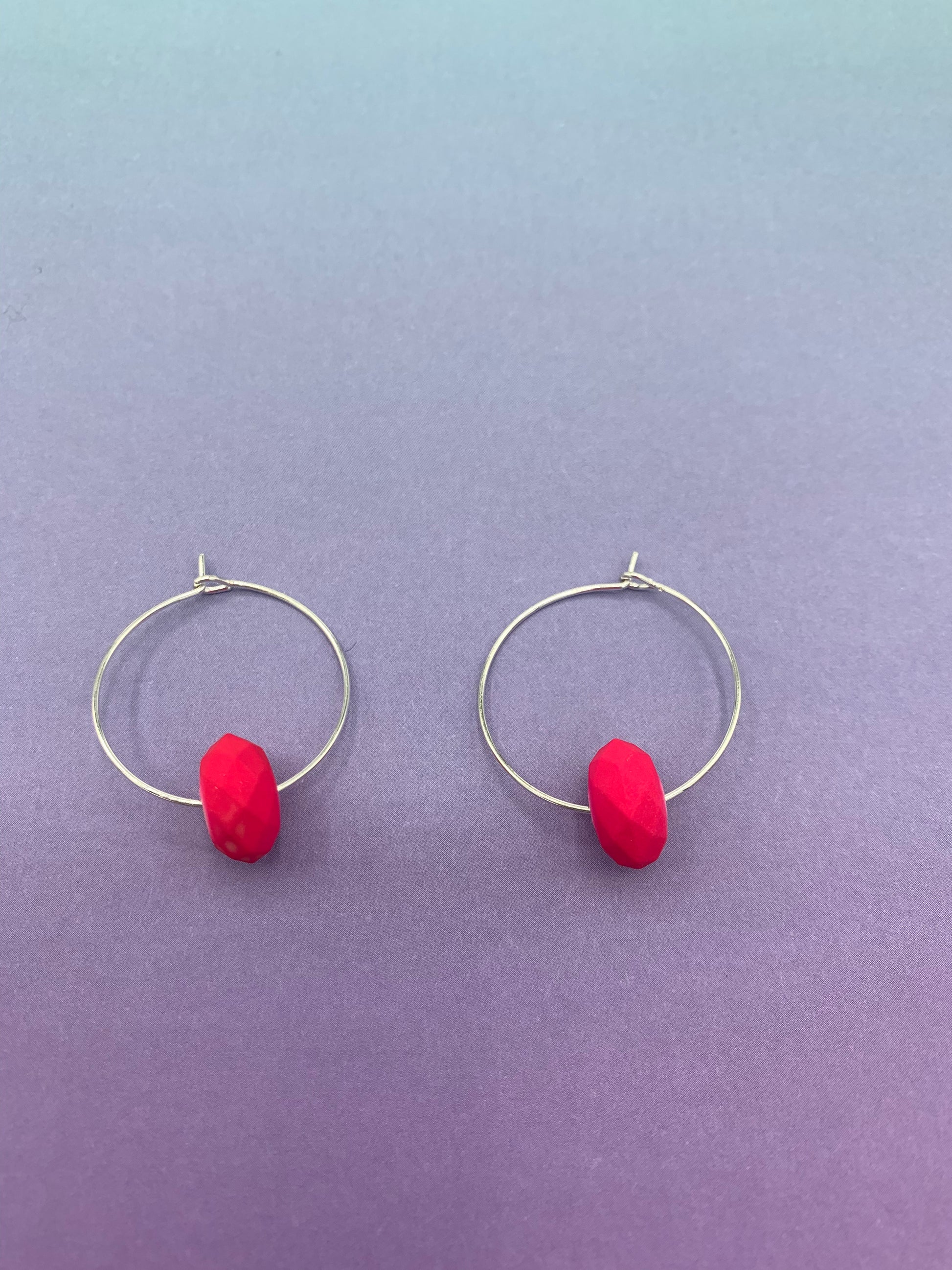 pink earrings. neon earrings. Neon pink faceted bead on silver plated hoops. hoop earrings. 