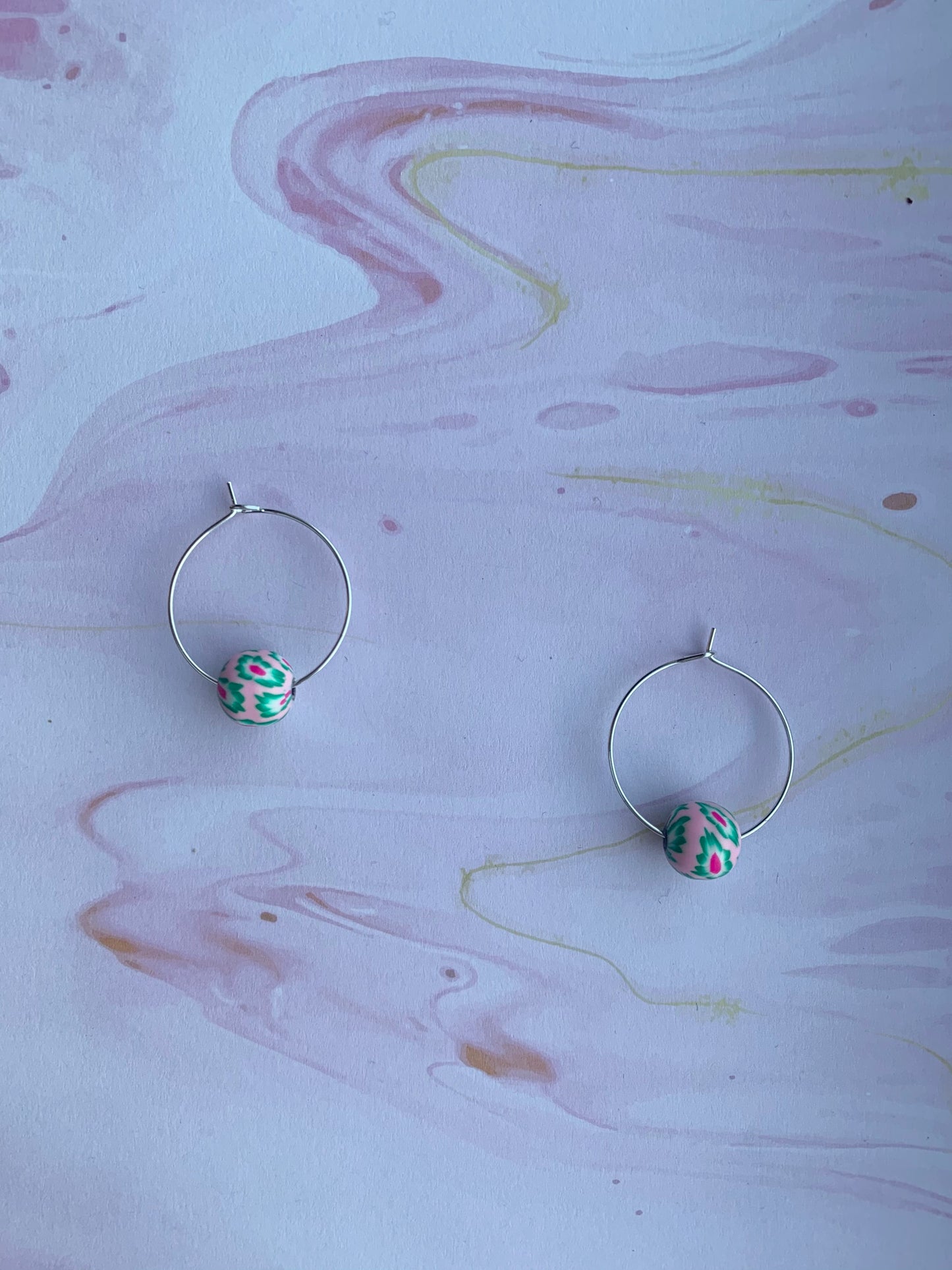 pale pink earrings. Polymer clay earrings. flower earrings. Polymer clay flower beads in a variety of colours on silver plated hoops. hoop earrings. 