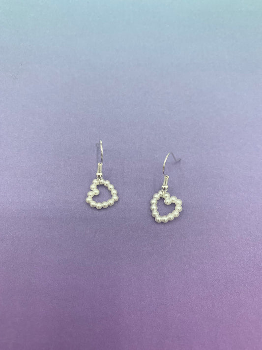 cute earrings. heart earrings. Pearl effect heart charm on silver plated hooks. fashion earrings. cute earrings for girls. 