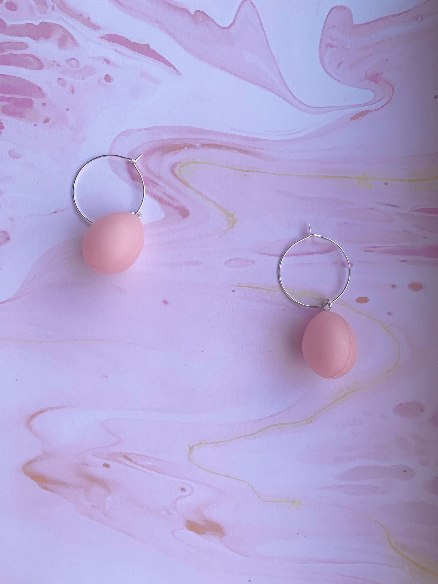 Easter Earrings. Pastel pink easter egg earrings on silver plated hoops. Plastic egg novelty easter earrings in pastel or speckled colours. Hoop earrings. Novelty earrings. pastel earrings. fun earrings. 