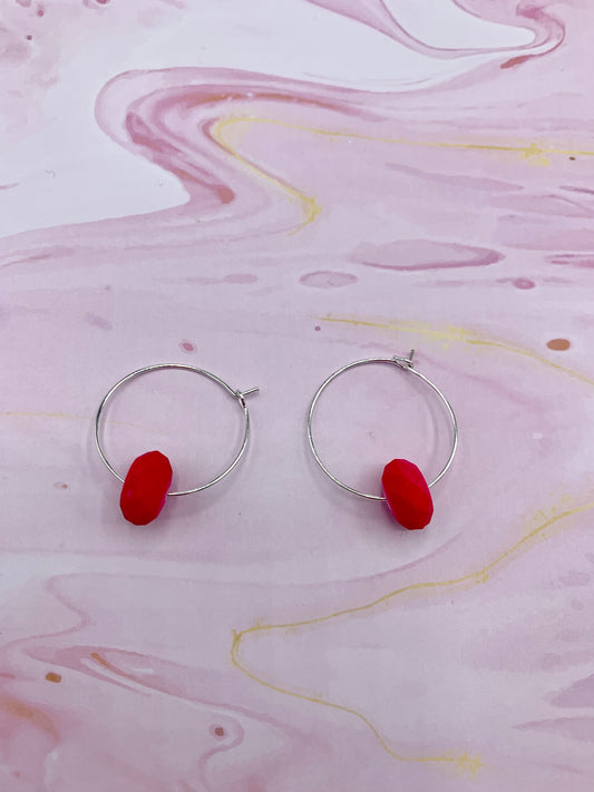 pink earrings. neon earrings. Neon pink faceted bead on silver plated hoops. hoop earrings. 
