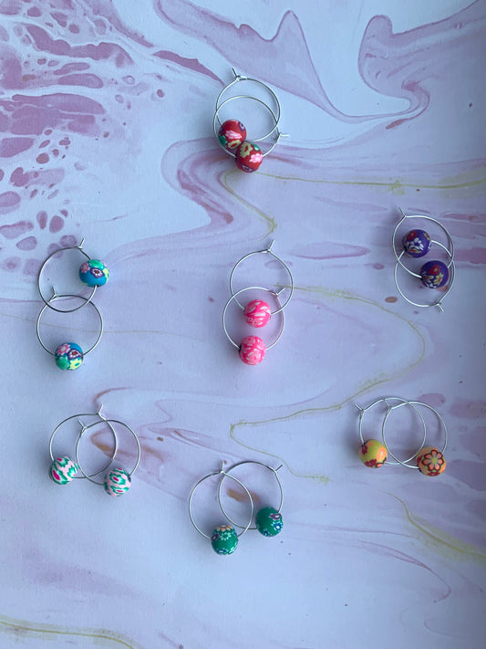 Polymer clay earrings. flower earrings. Polymer clay flower beads in a variety of colours on silver plated hoops. hoop earrings. 