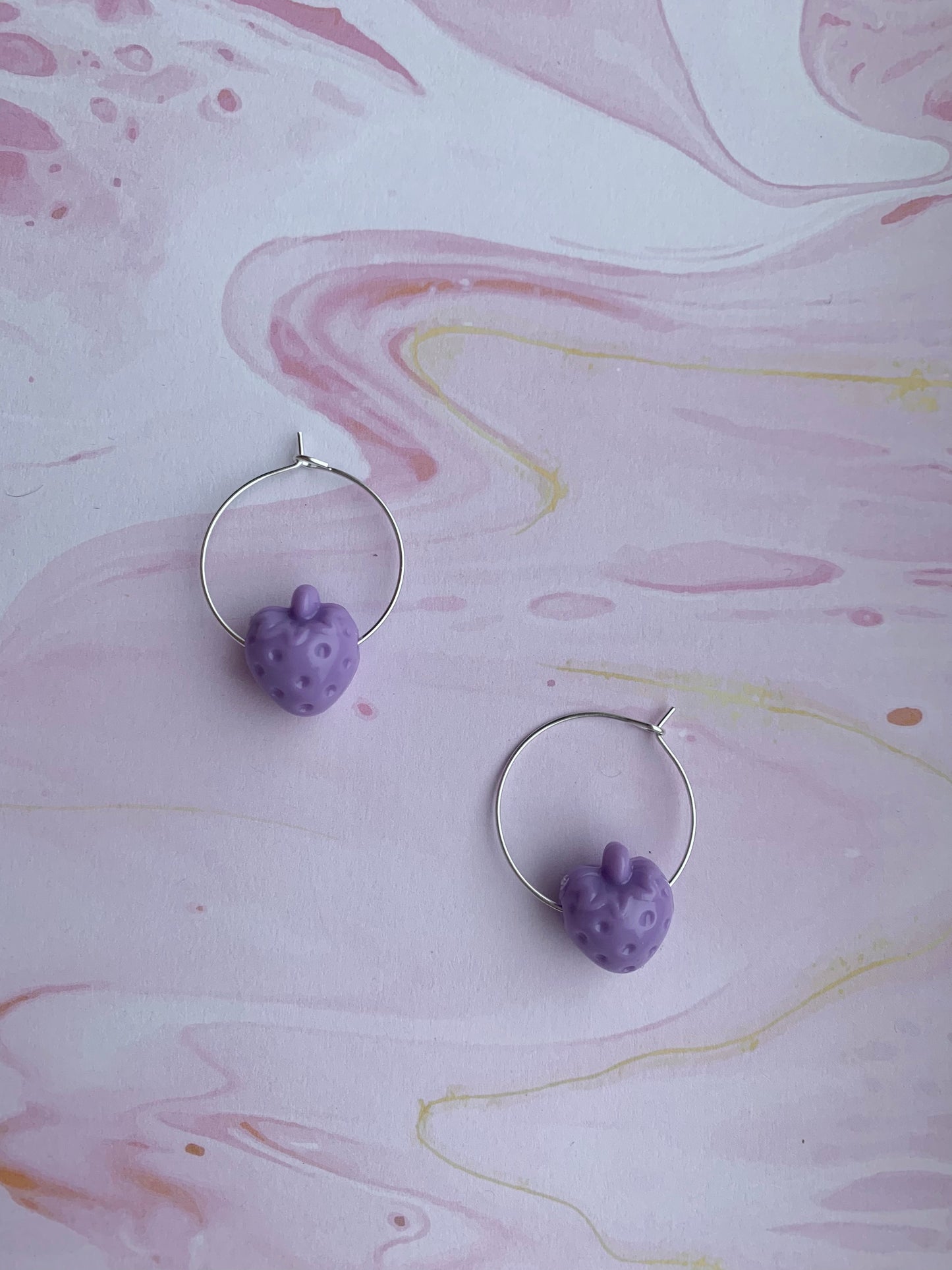 Purple coloured strawberry hoop earrings. hoop earrings