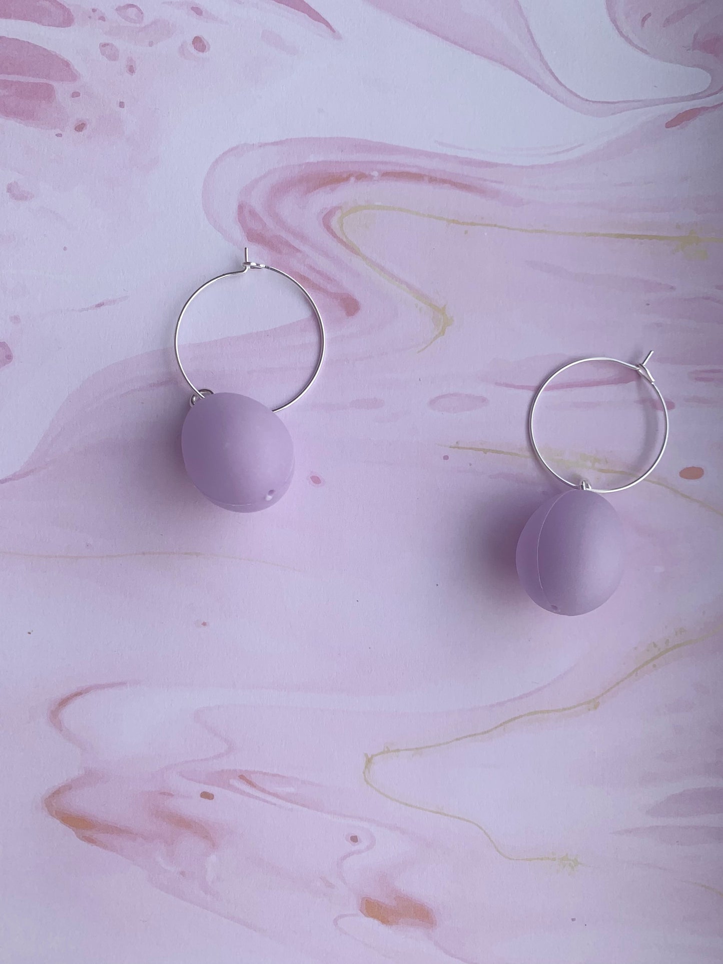 Easter Earrings. Pastel purple easter egg earrings on silver plated hoops. Plastic egg novelty easter earrings in pastel or speckled colours. Hoop earrings. Novelty earrings. pastel earrings. purple earrings. 
