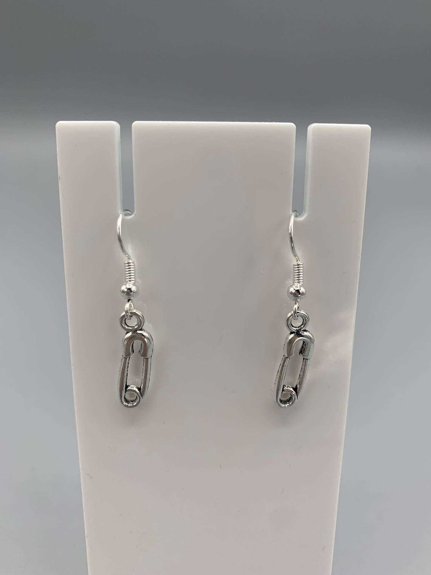 goth earrings. emo earrings. Silver coloured alloy safety pin charm on silver plated hooks.  earrings uk. funky earrings. 