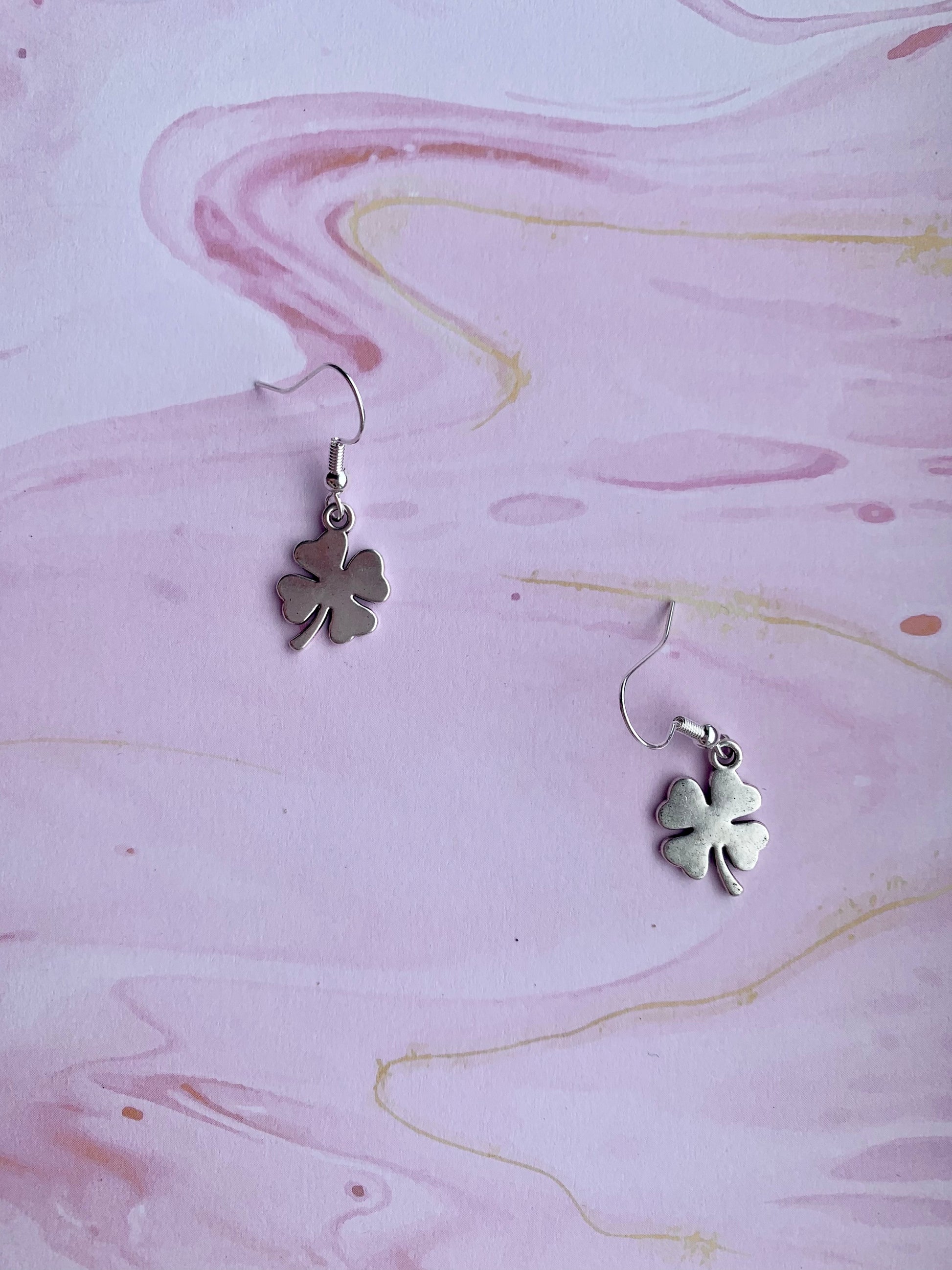 Lucky earrings. irish earrings. dangle earrings. Silver coloured alloy shamrock charm on silver plated hooks. st patricks day earrings. four leaf clover 