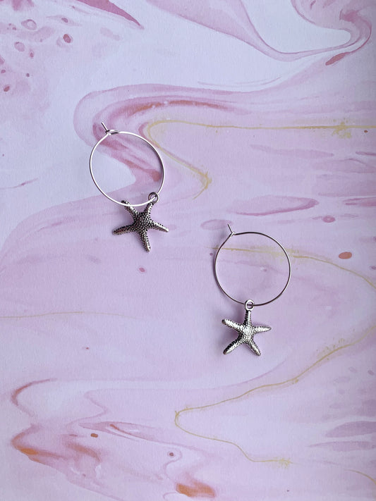 starfish earrings. mermaid earrings. alloy silver coloured charm on silver plated hoops. cute earrings. hoop earrings. 