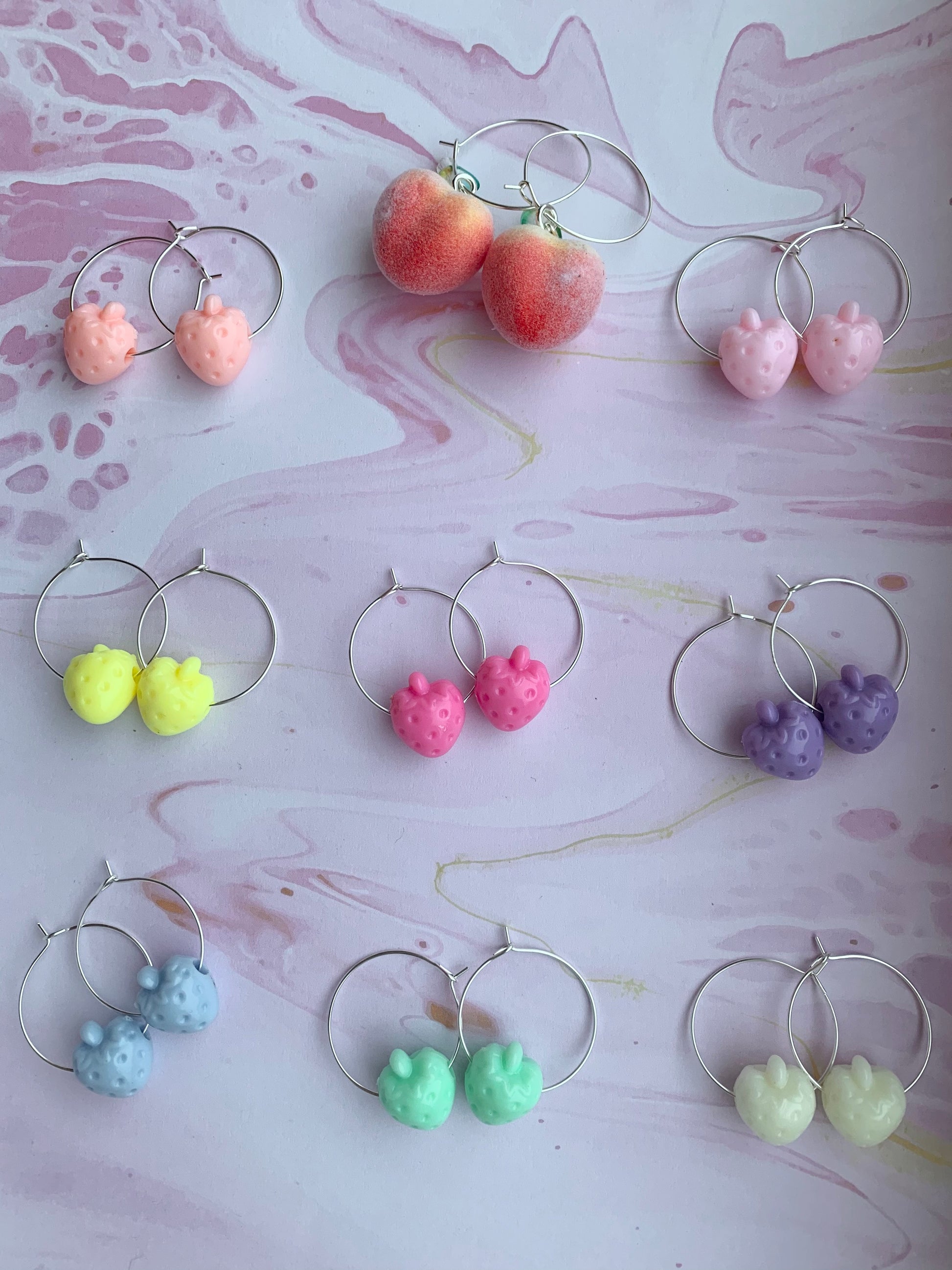 Strawberry earrings. peach earrings. Plastic pastel coloured strawberry beads on silver plated hoops. Fuzzy peach styrofoam charms with green bead leaf on silver plated hoops. hoop earrings. pastel earrings. food earrings. novelty earrings. fun earrings. 