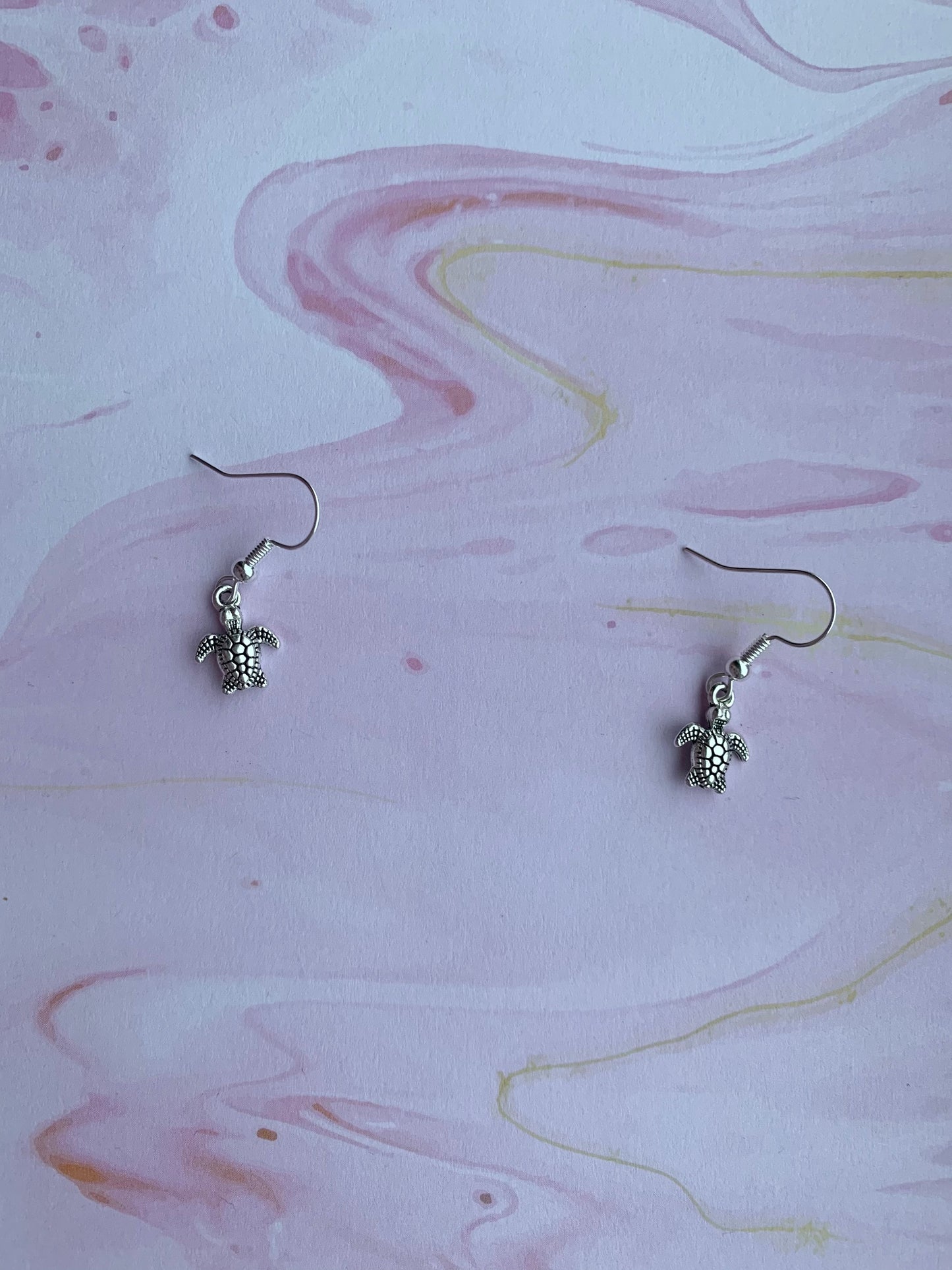 Cutest tiny turtle silver coloured alloy charm on silver plated hooks. dangle earrings. silver earrings. turtle earrings. animal earrings.