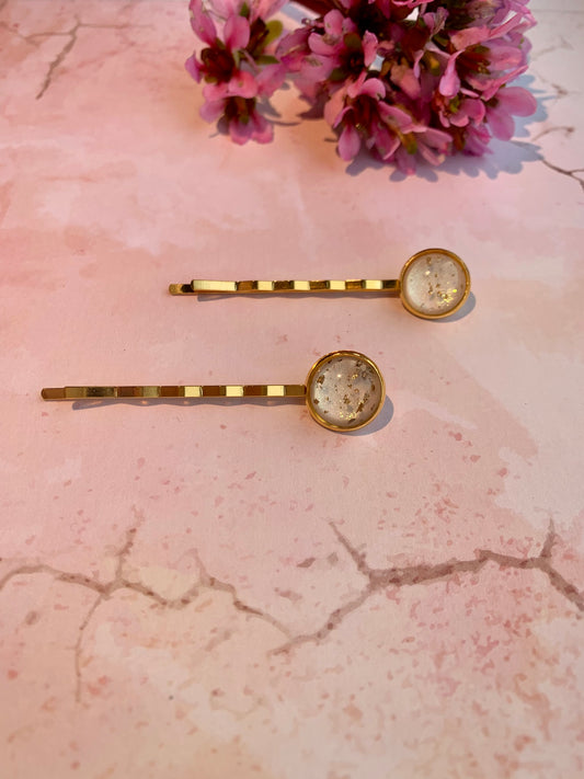 White and gold leaf hair grips